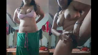 Busty brunette takes a sexy selfie in the bathroom