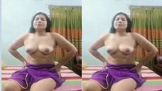 Busty Budi pleases herself with her hands