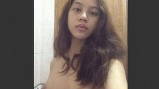 Sexy Malaysian college student gets naked and fucks with bigger nudes