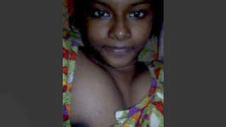 A charming Indian girl flaunts her large breasts in a steamy video