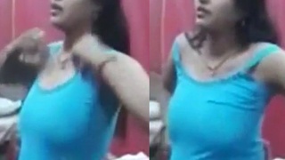 Indian Bhabhi plays with her big tits in solo video