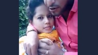 Cute Indian girl enjoys boob sucking in park