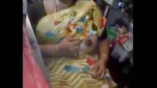 Aunty flaunts her large breasts for the store owner in a suggestive video