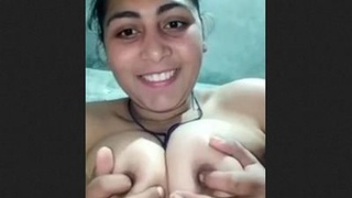 Indian girl flaunts her big breasts and pussy in a solo video