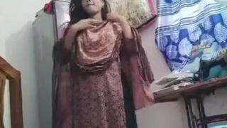 A cute desi girl flaunts her body on camera in a village setting