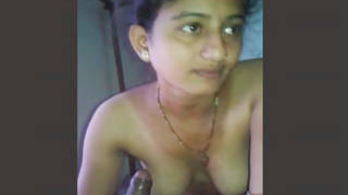 Tamil babe gets turned on and gives a blowjob in this video