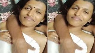 Tamil babe flaunts her breasts and pussy in a steamy video