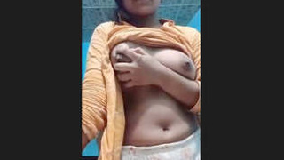 A stunning Indian woman reveals her breasts