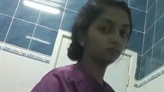 Solitary Indian nurse reveals her body in a conference room