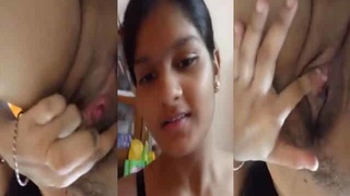 Busty girl pleasures herself with her fingers