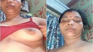 Exclusive video of a naughty Indian bhabhi exposing her breasts and pussy