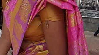 Tamil babe in sari flaunts her big boobs at a temple in HD