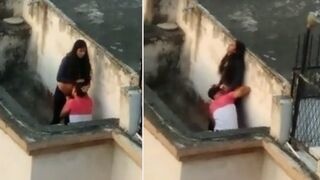 Indian wife enjoys a secret lesbian encounter on the balcony, caught on MMS