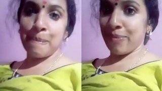 Watch a busty Desi bhabi show off her assets
