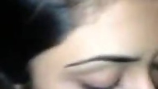 Amateur girl gives a blowjob to a man