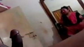 Indian bhabhi gives her brother a blowjob and keeps an eye out for intruders