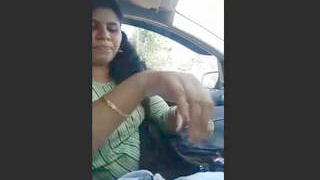 Indian girl gives a blowjob in a car