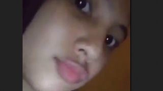 Young girl shows off her tight pussy in a steamy video