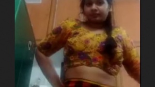 Naked Tamil girl brushes her hair and pussy in a seductive manner