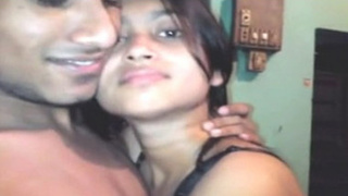 Indian girl with a cute face and perky tits in a hot video
