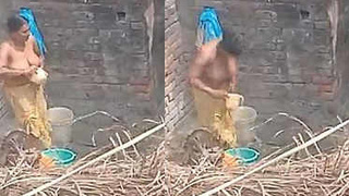 Indian aunty takes a bath in the great outdoors