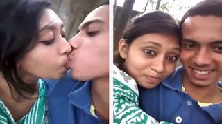 College student babe kisses in the park