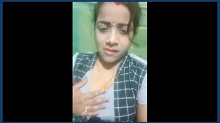Watch a stunning bhabhi flaunt her body and pussy in this steamy video