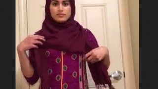 Hijab-clad baby with a huge butt