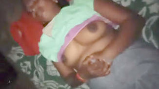 A modest wife with ample breasts giving oral pleasure to her spouse