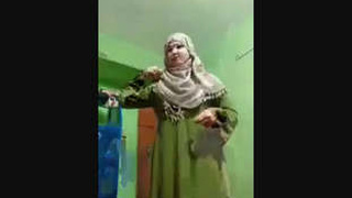 Muslim woman in burka shows off her beauty