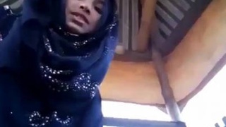 Sultry hijabi teen flaunts her cute pussy in solo video