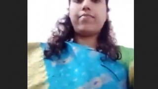 Desi bhabhi strips and teases in a sari, revealing her sensual curves