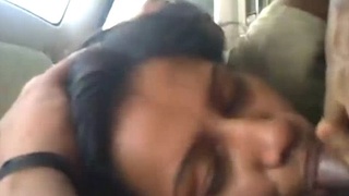 A girlfriend enjoys a deep blowjob in a car while her boyfriend drives