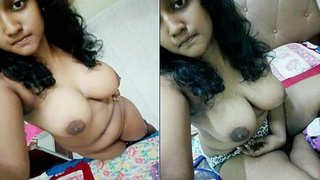 Indian girl shows off her boobs and fingers herself