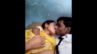 Desi lovers indulge in passionate smooching and pressing on breasts